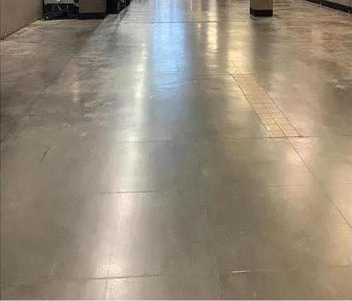 Commercial building concrete floor dry after water removal 