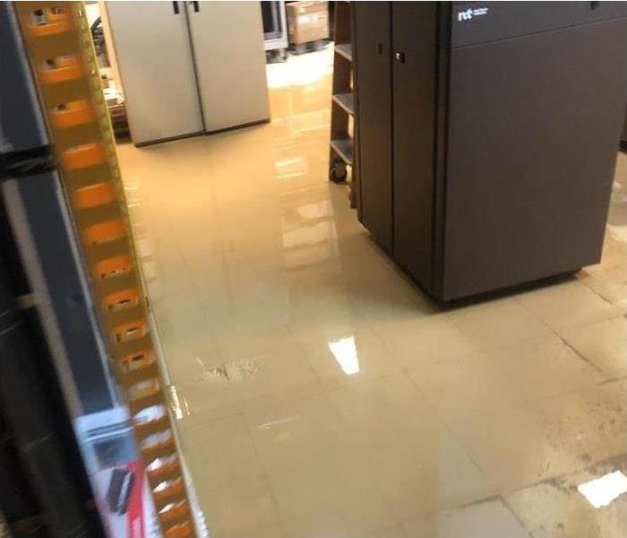 Office floor completely flooded from water damage